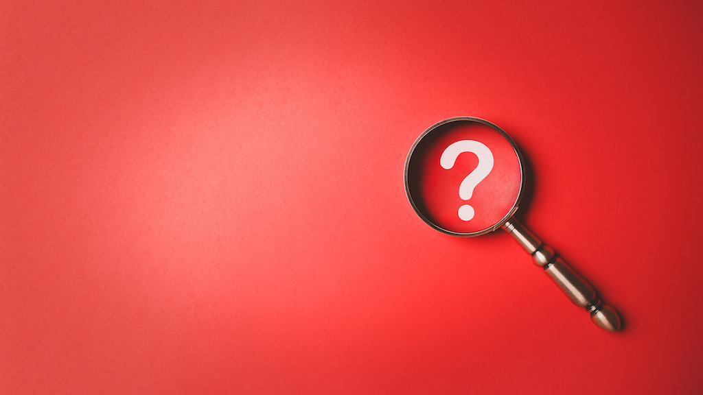 Magnifying glass and question mark icon symbol on red paper background with copy space. Problem solving troubleshooting education concept. Expert watch repair