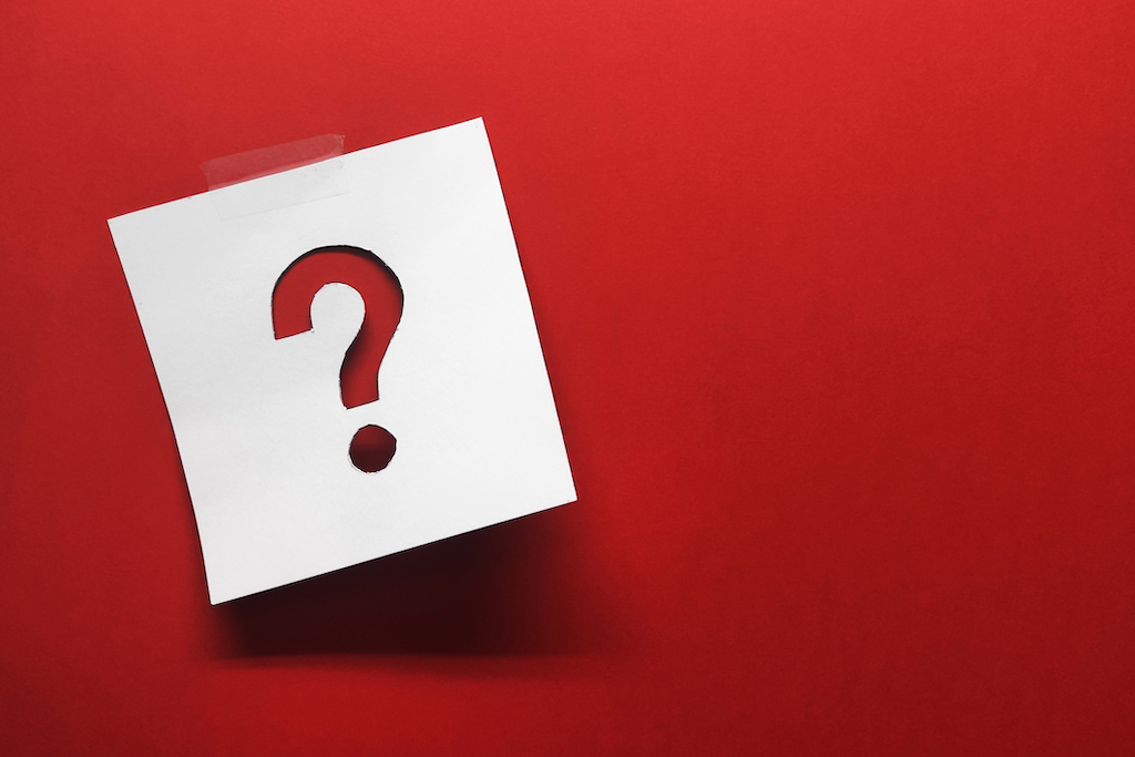 A red question mark on note paper taped to red background. FAQ about jewelry repair