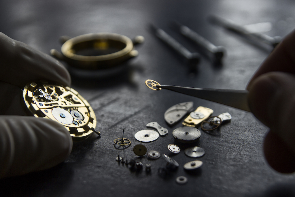Watchmaker carefully repairing watch. | General Watch Repair & Service